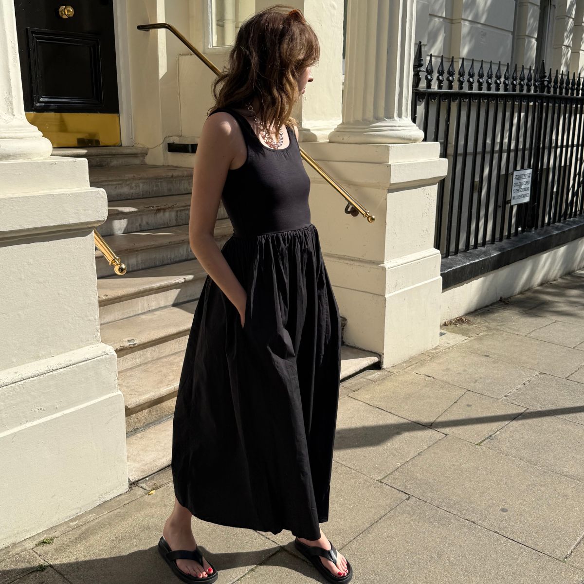 Megan Storey social media editor wearing the Nobody's child tank top dress in black