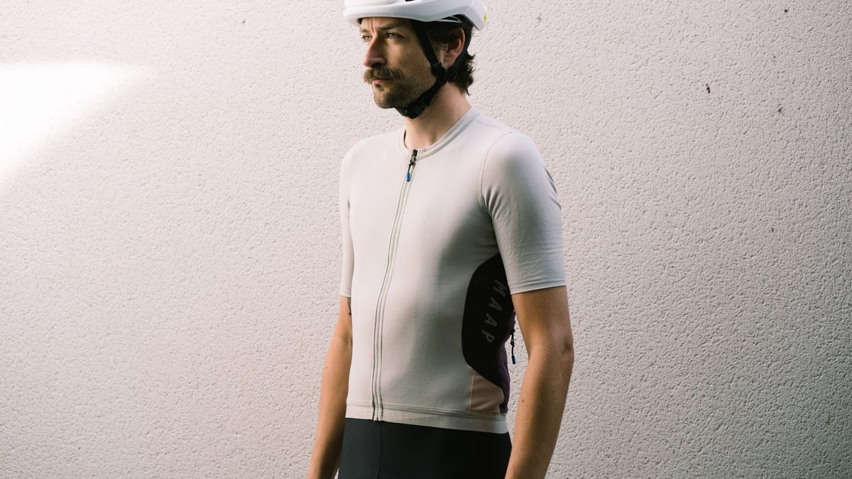 Maap Alt_Road jersey worn by a man against a white wall