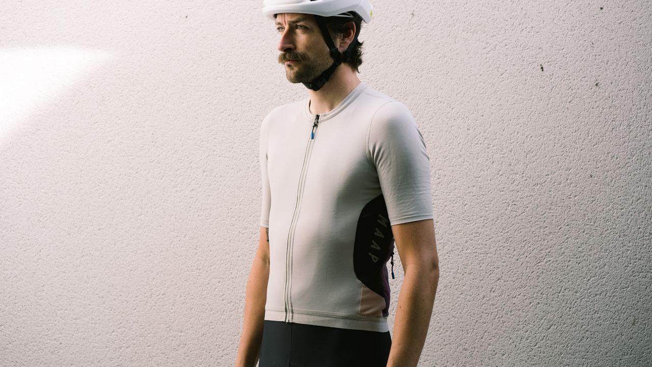 Maap Alt_Road jersey worn by a man against a white wall