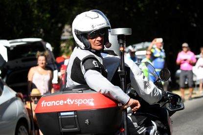 Tommy Voeckler on a motorbike at the Tour de France