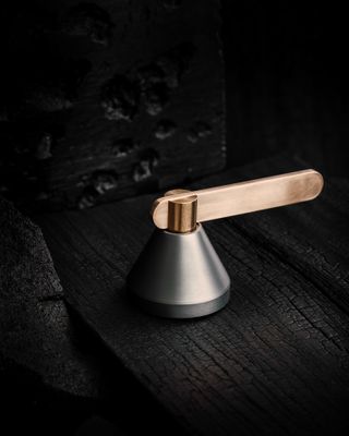 Design Door Handle by Vbokkr in brass and steel shown on a black background