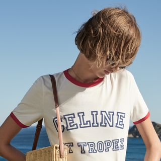 Woman in Celine t-shirt in sunshine
