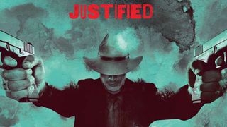 A press shot for the TV show Justified showing a man with his head bowed pointing two guns in the air.