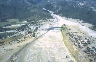 This aerial photo from December 9, 1985, nearly a month after the event, shows the devastating debris flows that swept down from Colombia's Nevado del Ruiz volcano.