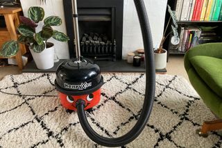 Henry Xtra vacuum cleaner with the brush fitted in the holder
