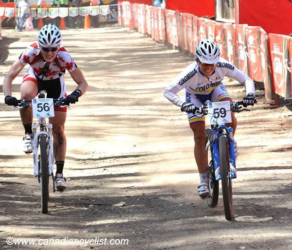 Angela Parra Sierra (Colombia) outsprints Mical Dyck (Canada) for fourth place.