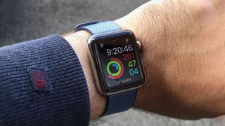 Apple Watch showing walking steps on someone's wrist.