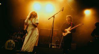 The Heavy Heavy's Georgie Fuller [left] and William Turner play live under gold stage lights, a fitting setting for their retro-inspired sound