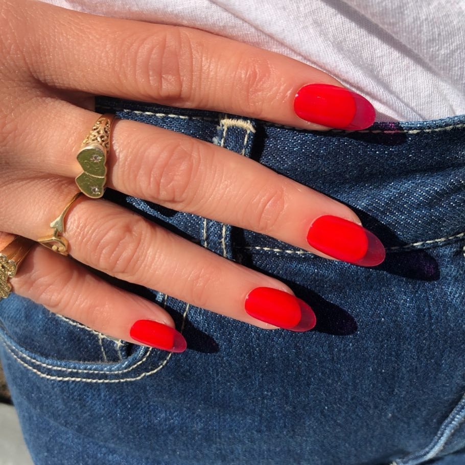 Person with red cherry glaze jelly nails.