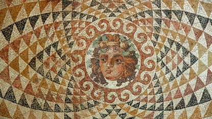 An ancient Greek mosaic tile piece of art.