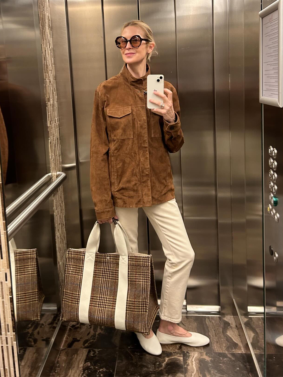 Selfie of Kelly Rutherford wearing white jeans and a camel suede jacket.