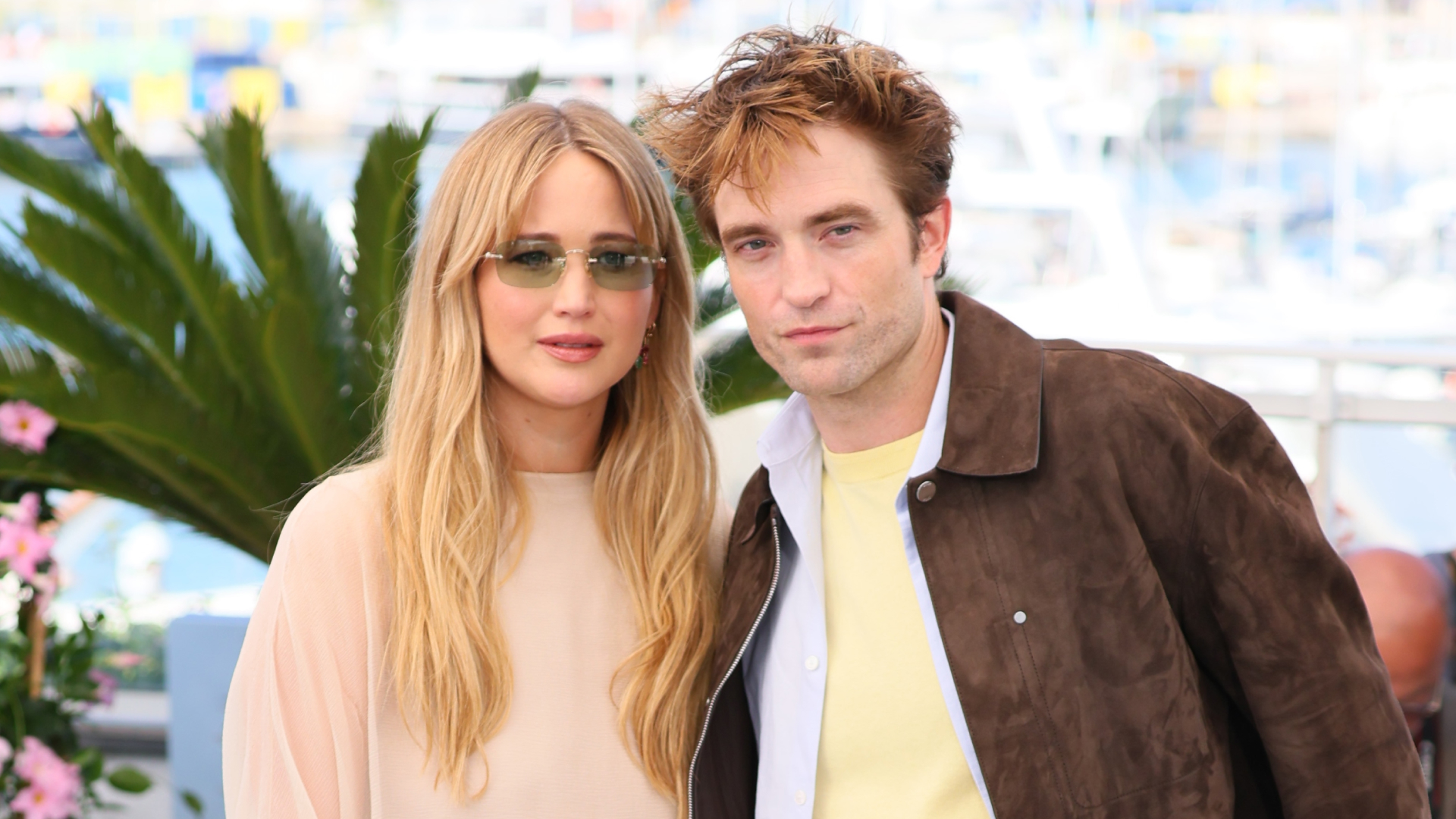 Jennifer Lawrence wears a floaty Dior outfit and carries a luxury Dior handbag for Cannes Film Festival photocall with Robert Pattinson