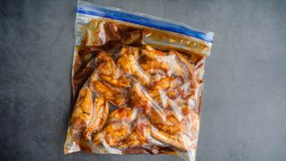 Chicken marinating in a Ziploc bag