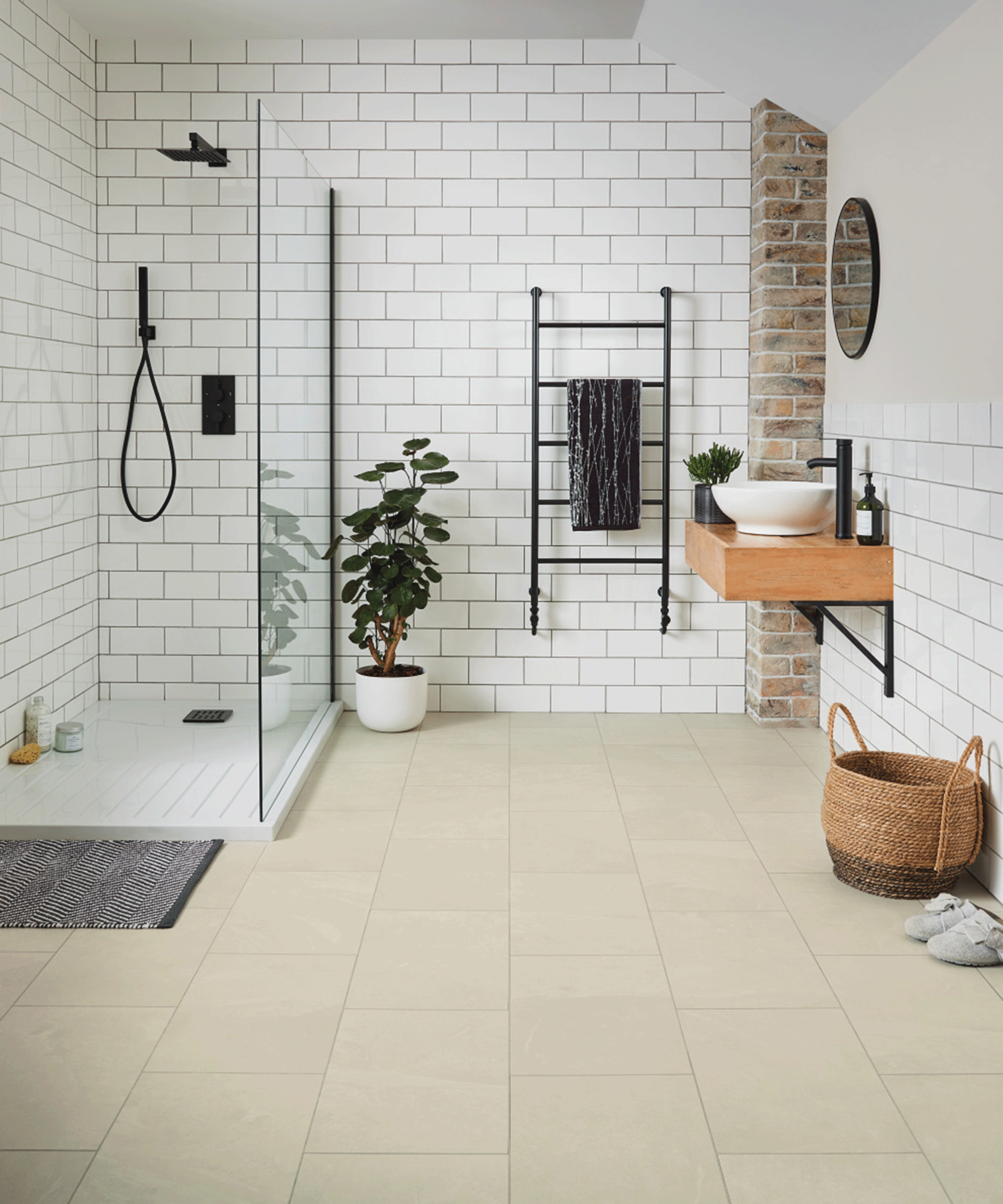 A bathroom with Karndean Knight floor tiles, shower and ladder towel rail