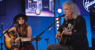 Arielle and Brian May perform at the Gibson Garage London. Both play the Queen guitarist's new signature 12-string acoustic.