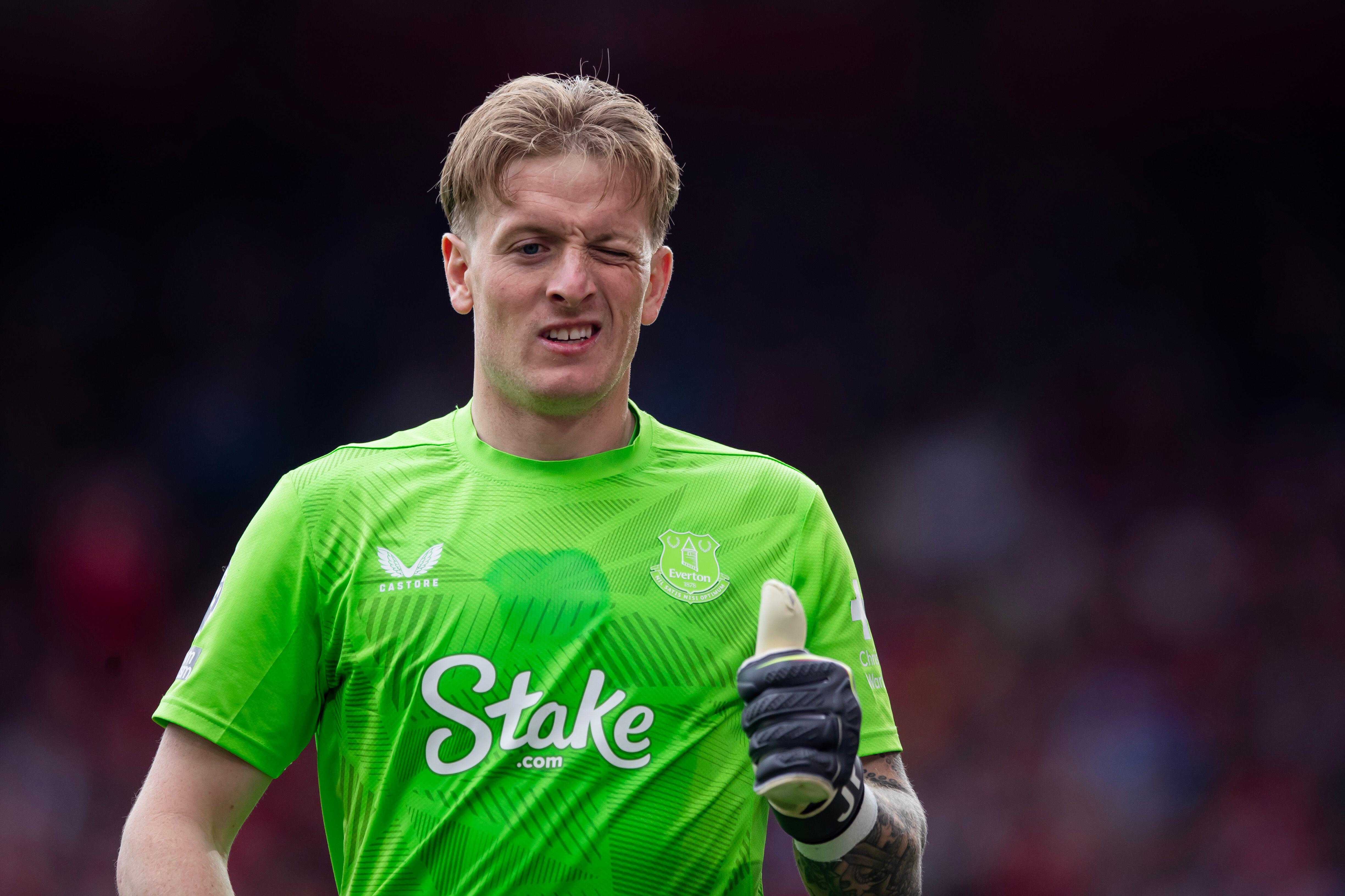 Jordan Pickford winks and gives a thumbs-up while playing for Everton against Nottingham Forest, April 2025.