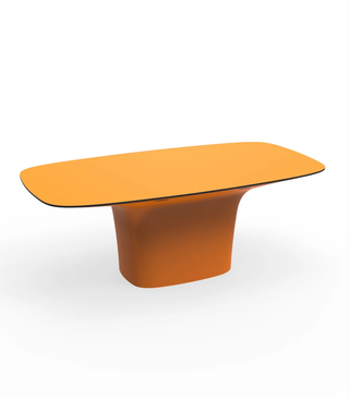 Modern orange statement dining table.