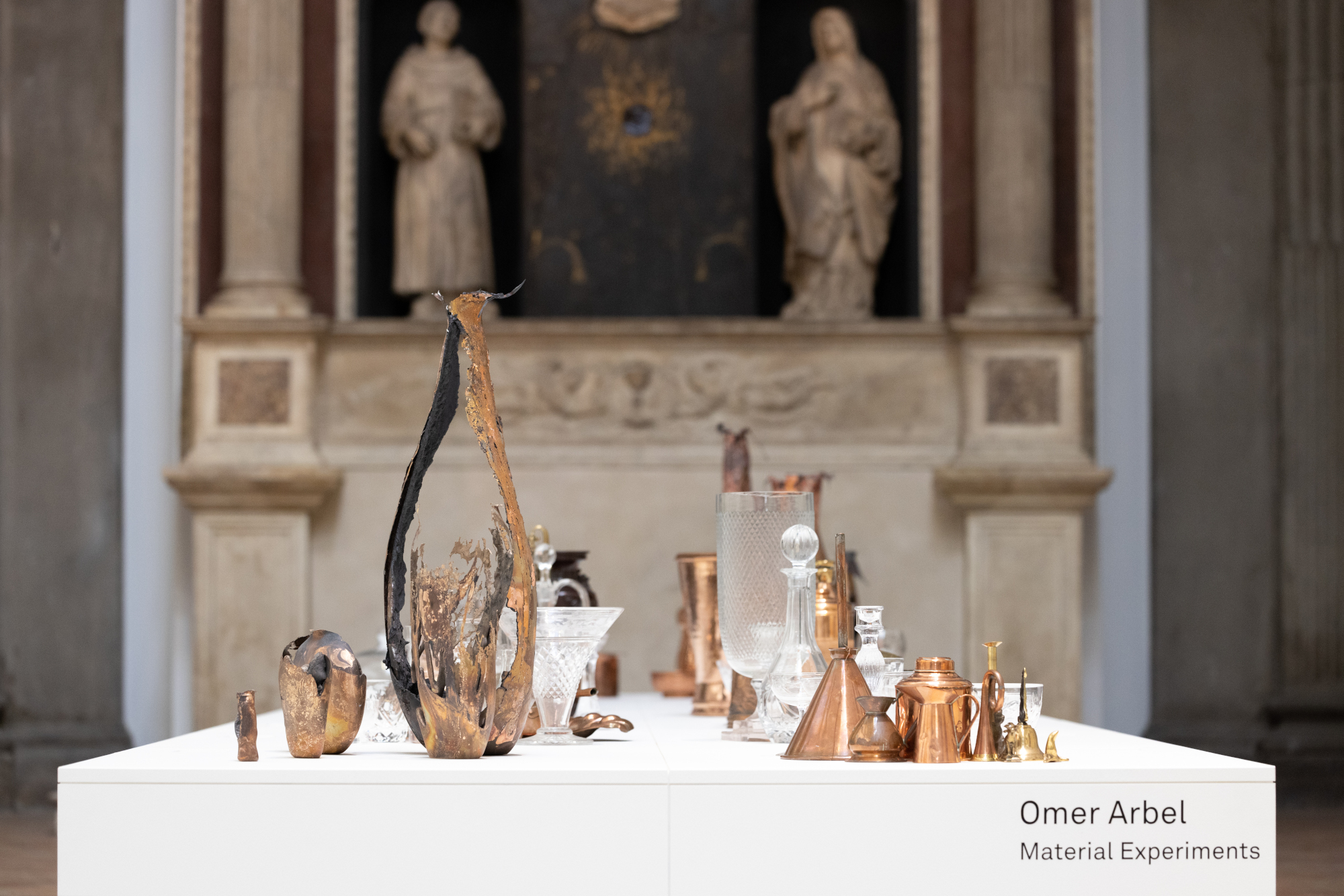 Sculptures and found objects on a table at the V&A, part of Omer Arbel glass-blowing show, ‘Material Experiments‘