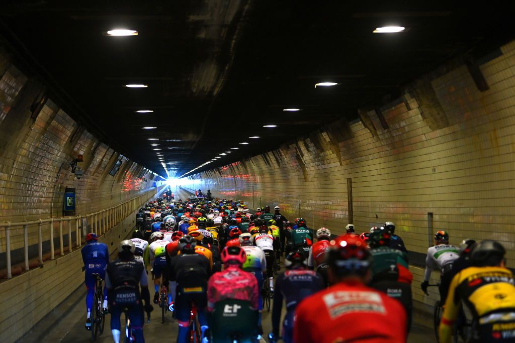 The Tour of Flanders peloton leave Antwerp via a tunnel