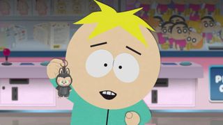 Butters holds a Labubu keyring