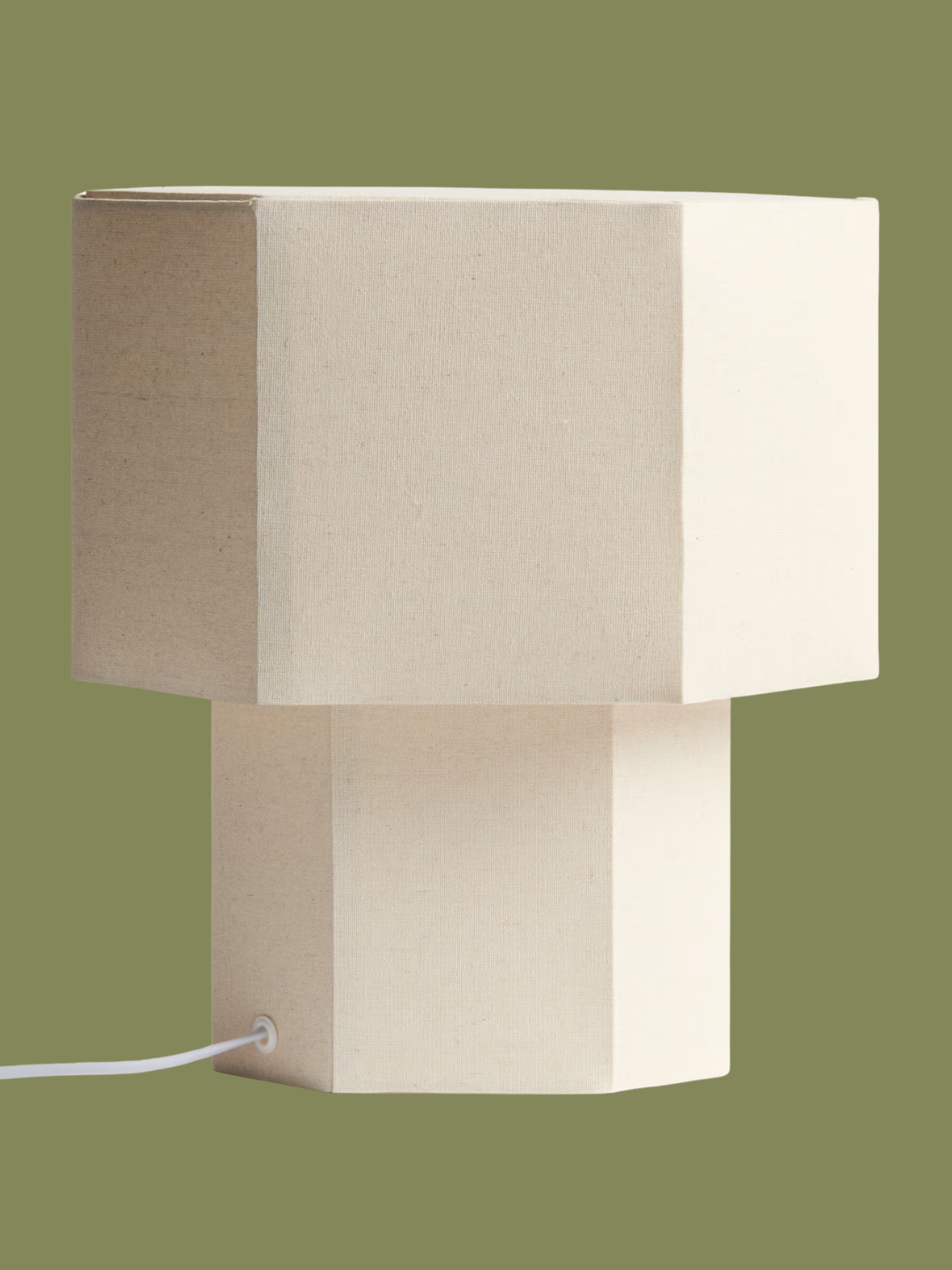A light beige hexagonal table lamp from H&amp;amp;M
