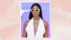 Naomi Campbell is pictured wearing a white dress and sunglasses whilst attending the V&A Summer Party 2024 Celebrating "NAOMI: In Fashion" at The V&A on June 19, 2024 in London, England/ in a pink watercolour paint-style template