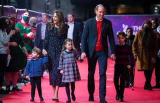 Prince William, Duke of Cambridge and Catherine, Duchess of Cambridge with their children, Prince Louis, Princess Charlotte and Prince George, attend a special pantomime performance