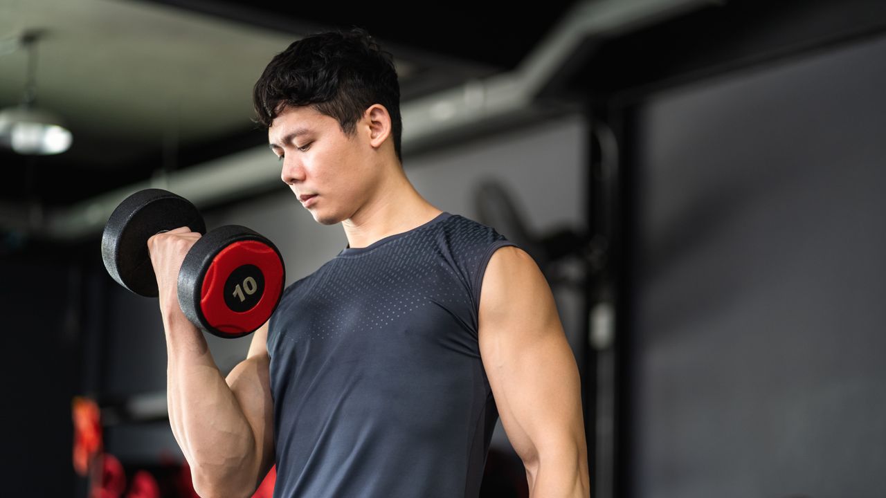 Man performing biceps curls