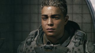 Mags Carter looks at herself in a mirror in the Gears of War co-op campaign
