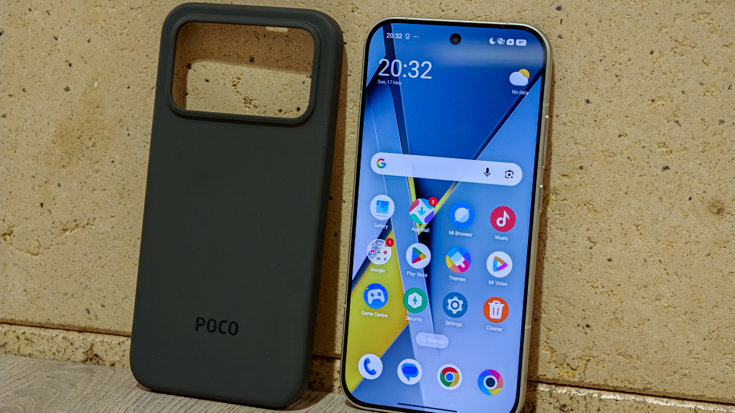 Poco F8 Pro in the hand in silver