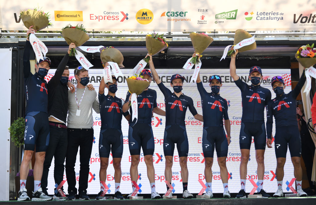 BARCELONA SPAIN  MARCH 28 Podium  Richie Porte of Australia Richard Carapaz of Ecuador Adam Yates of United Kingdom Geraint Thomas of United Kingdom Rohan Dennis of Australia Jonathan Castroviejo of Spain  Luke Rowe of United Kingdom and Team INEOS Grenadiers Celebration best team during the 100th Volta Ciclista a Catalunya 2021 Stage 7 a 133km stage from Barcelona to Barcelona  Mask  Covid safety measures  Flowers  VoltaCatalunya100  on March 28 2021 in Barcelona Spain Photo by David RamosGetty Images