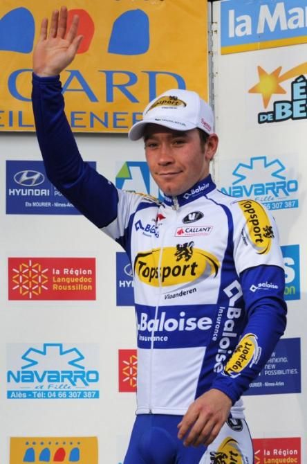 Michael Van Staeyen of Belgium celebrates on the podium after winning the first stage