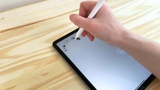 Close up of the barrel squeeze controls on the Apple Pencil Pro in action on the iPad Mini 7