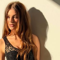 Camila Morrone with a long, tousled hairstyle