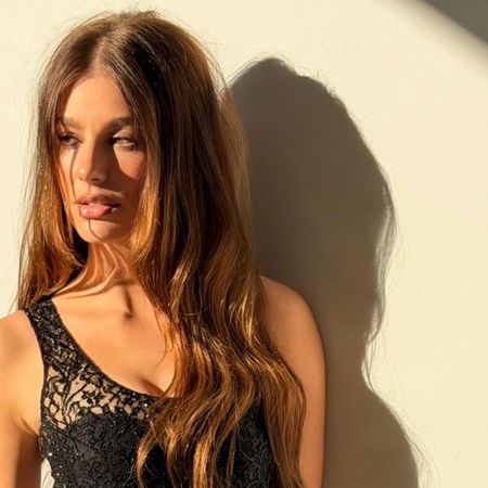 Camila Morrone with a long, tousled hairstyle