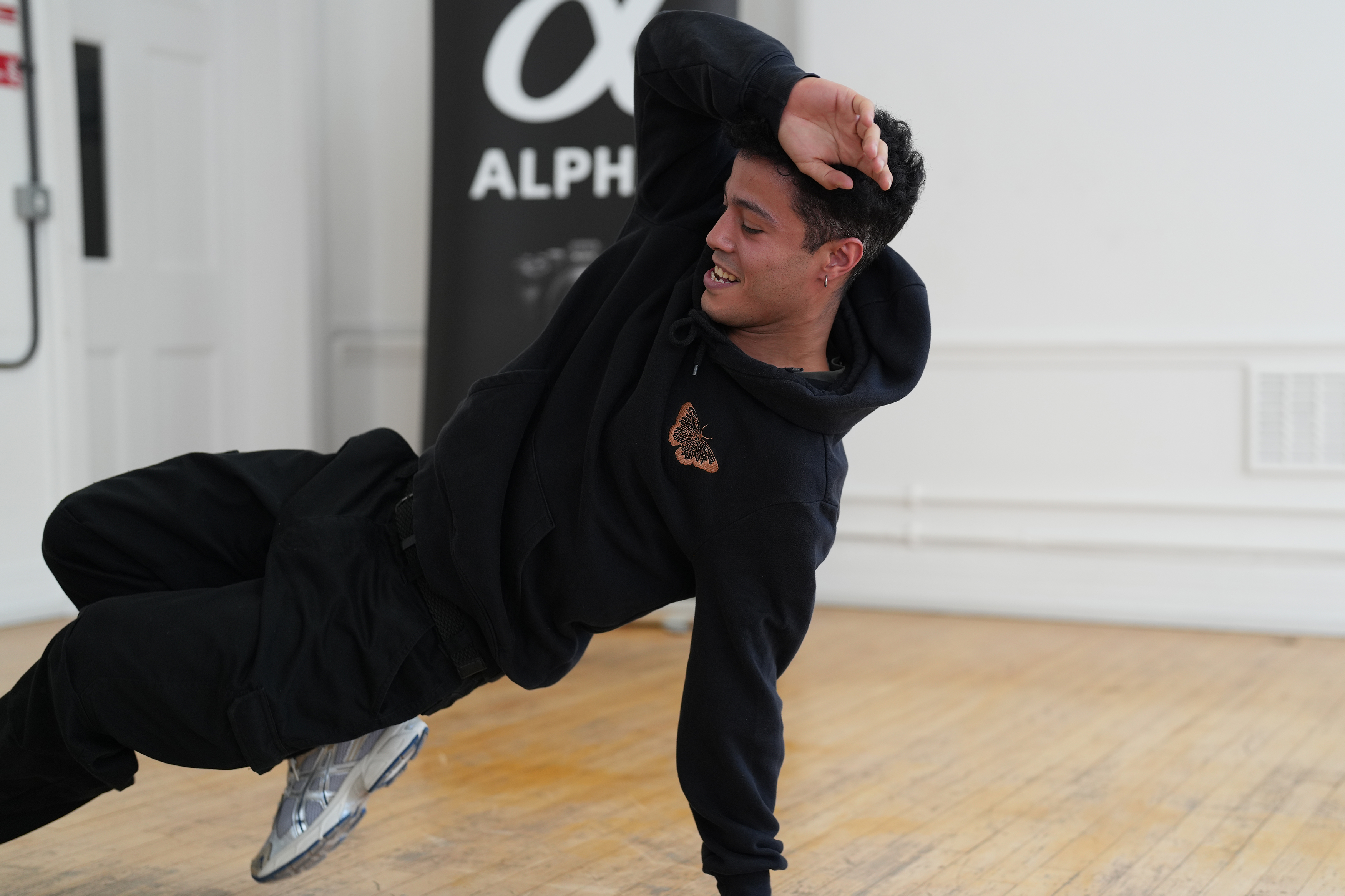 A man break dancing in a studio