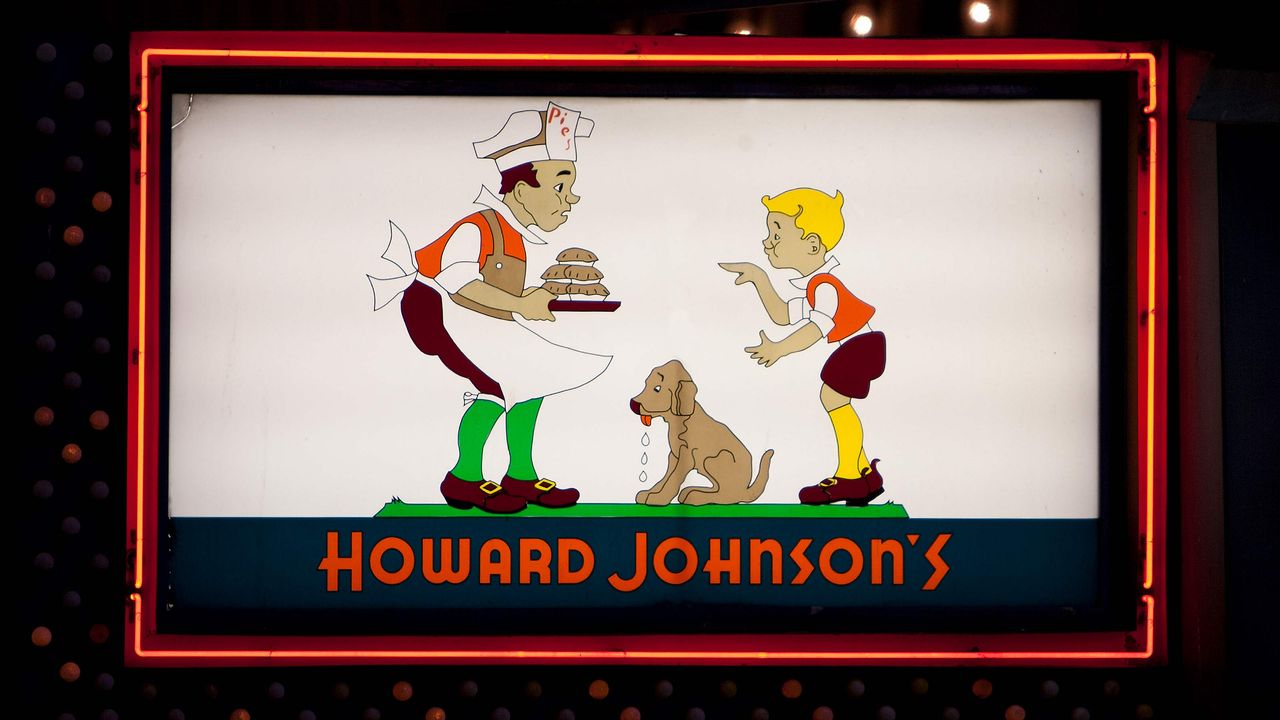 Howard Johnson&amp;#039;s restaurant sign at the famous 1960&amp;#039;s restaurant in Times Square New York City. Original logo on sign with neon outline at night.&amp;quot;