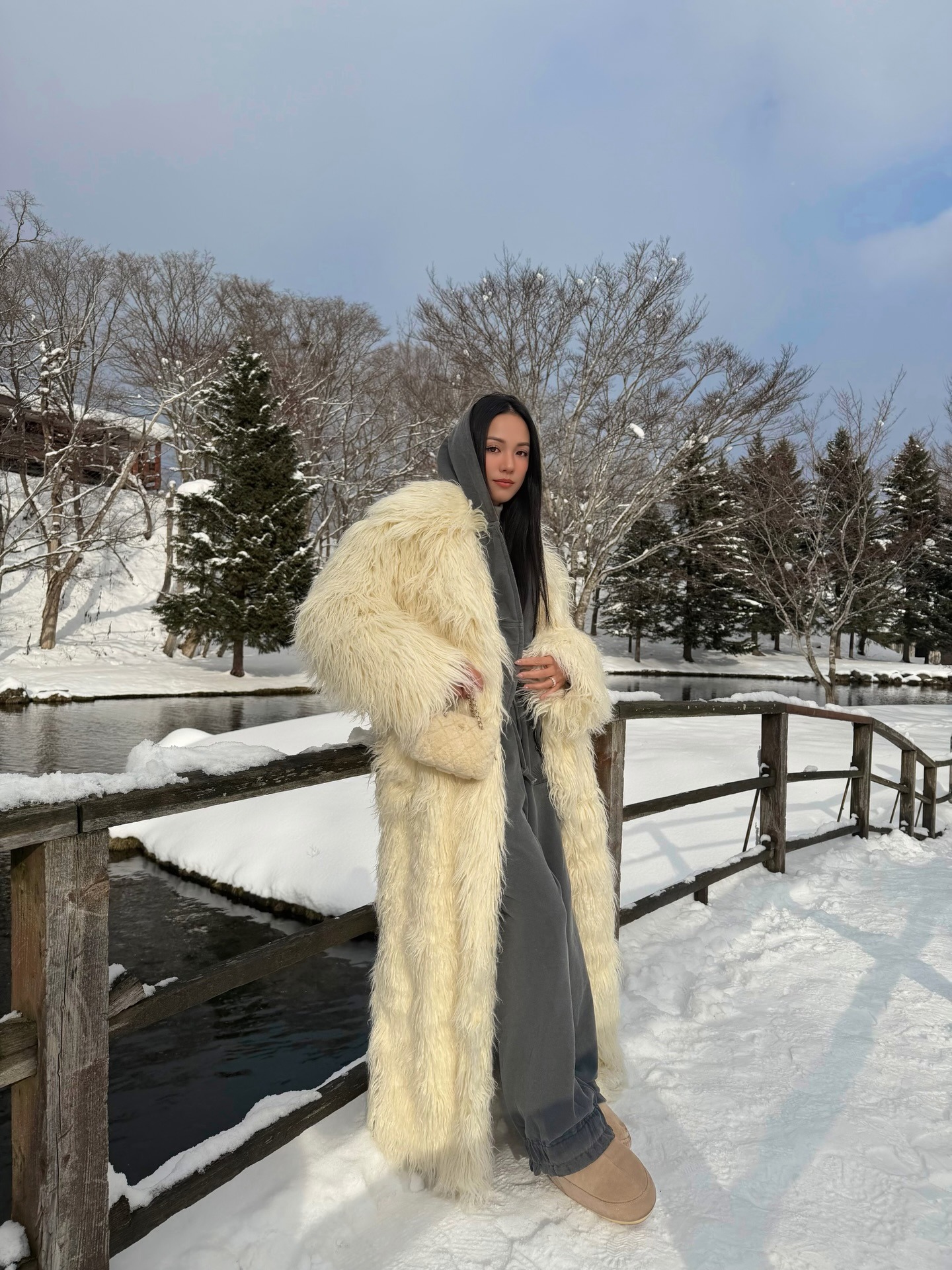 Yoyo Kulala wears a chic apres ski outfit.