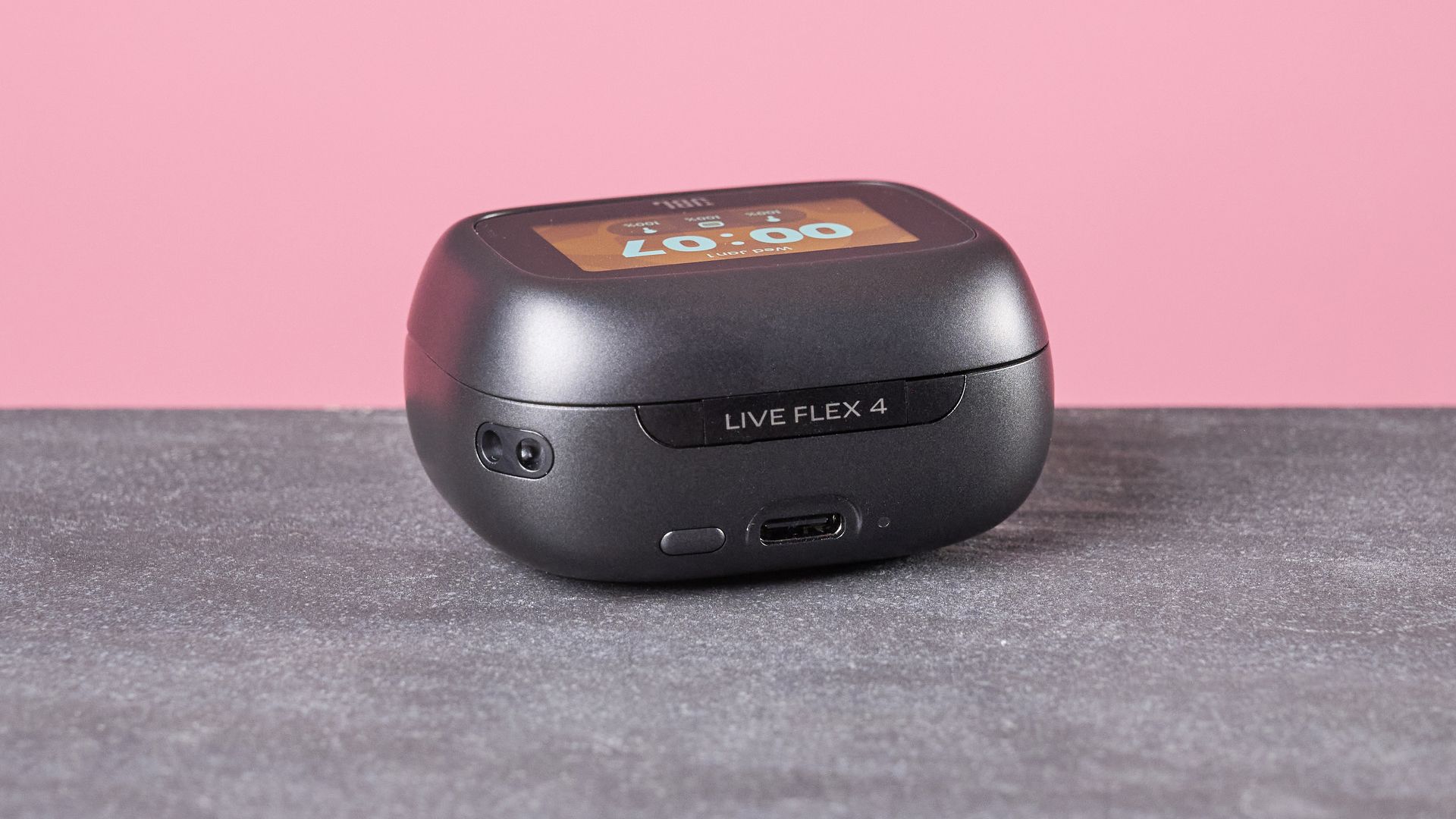 JBL Live Flex 4 on table with display on