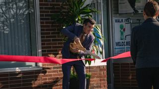 Brian d'Arcy James at a ribbon cutting ceremony in Pain Hustlers