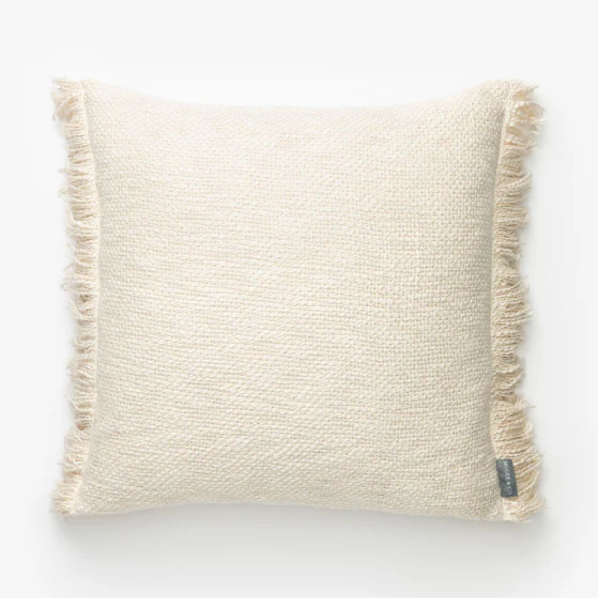 square cream cushion with tassel edge