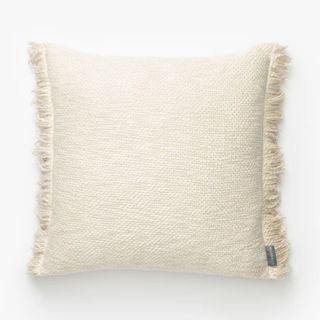 square cream cushion with tassel edge