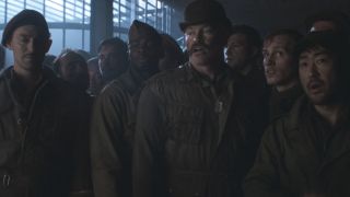 The Howling Commandos stand with other prisoners awaiting orders in Captain America: The First Avenger.