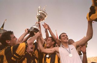 Peñarol players celebrate after winning the Uruguayan championship in October 1999.