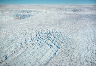 Aerial view of greenlandic ice cap near Jakobshavn Glacier also known as Ilulissat Glacier. The picture has been taken from a plane