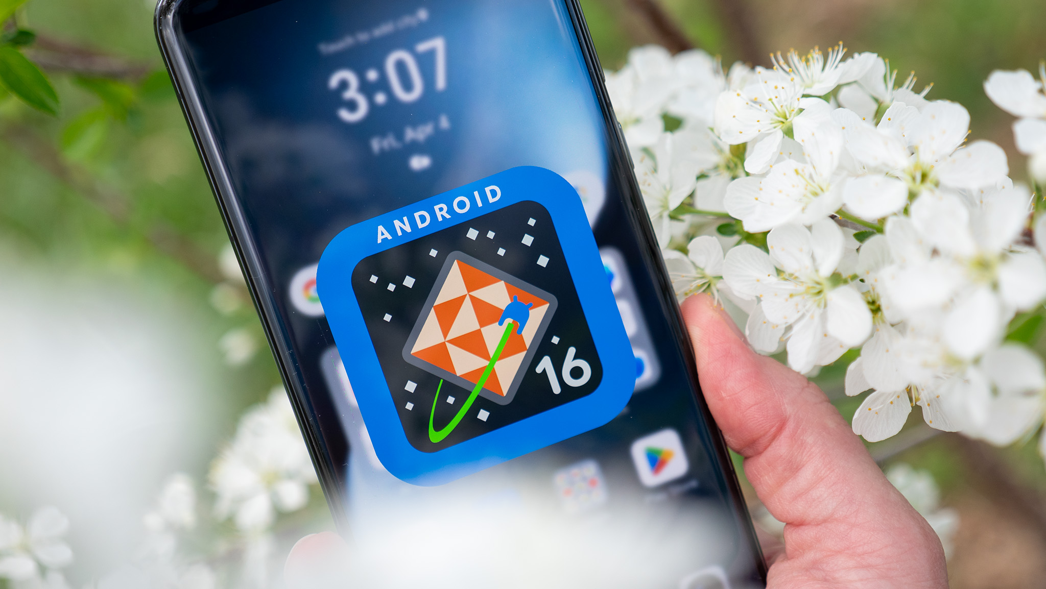A blue and orange Android 16 logo on an Honor Magic 7 Pro