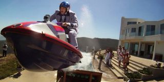 Johnny Knoxville flying through the air on a jet ski