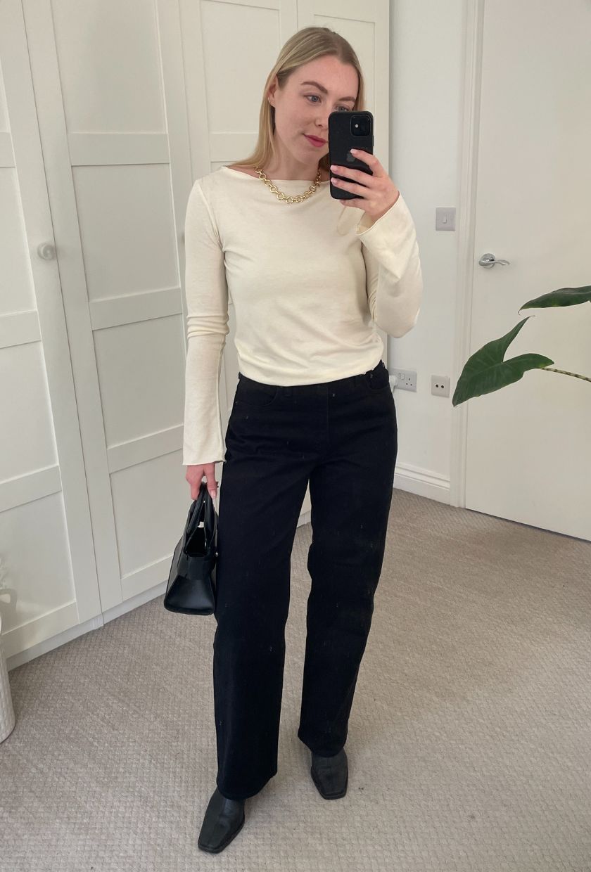 Woman wears yellow top, black jeans, black boots