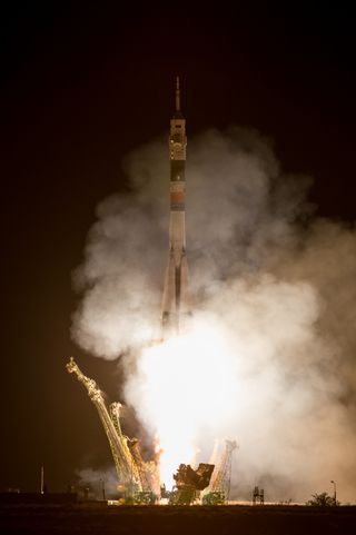 A Soyuz rocket with Expedition 36/37 Soyuz Commander Fyodor Yurchikhin of the Russian Federal Space Agency (Roscosmos), Flight Engineers: Luca Parmitano of the European Space Agency, center, and Karen Nyberg of NASA, onboard, launches from the Baikonur Cosmodrome in Kazakhstan to the International Space Station, Wednesday, May 29, 2013.