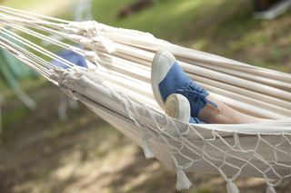 Close up of feet in a hammock.